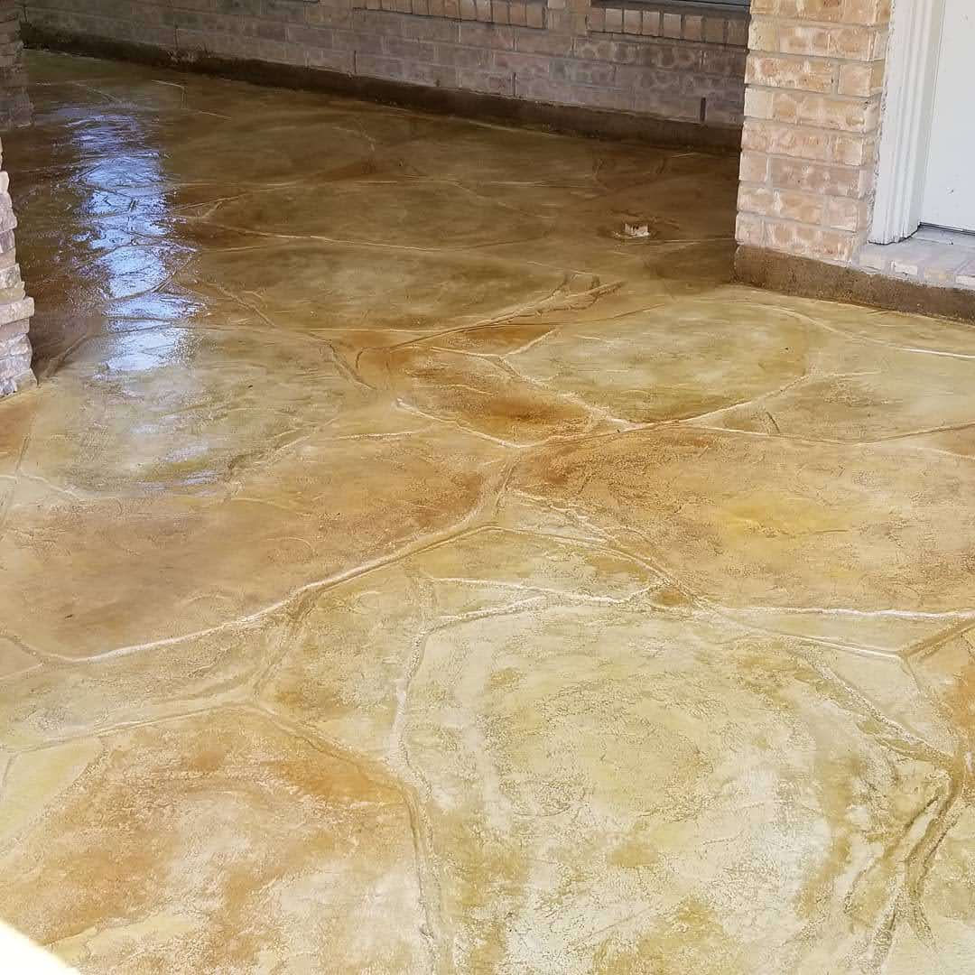 Decorative stained concrete floor with a polished finish in a spacious indoor area.