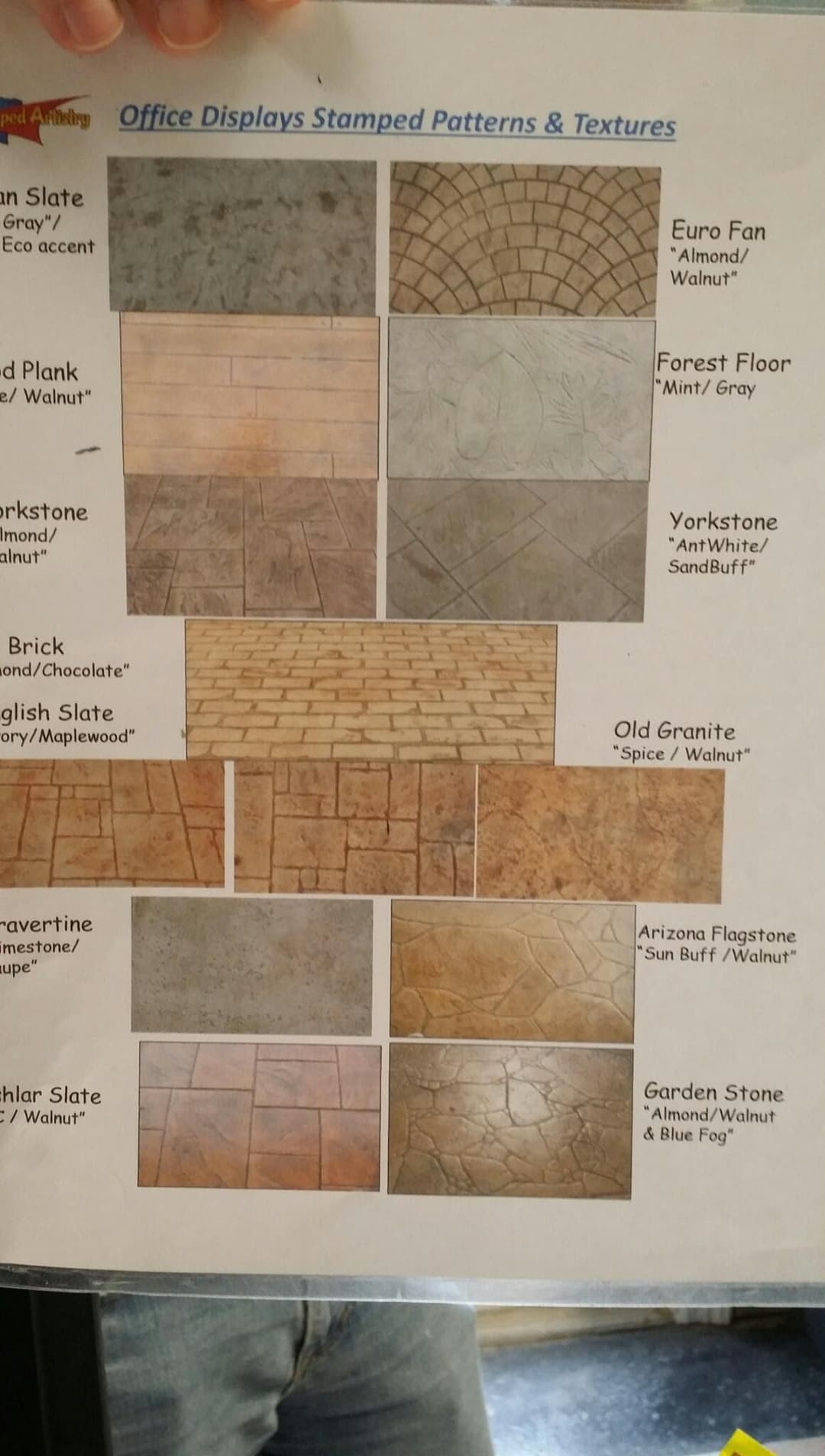Office display of stamped patterns and textures, featuring various flooring options.