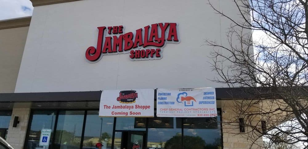 The Jambalaya Shoppe sign on a restaurant building with a "Coming Soon" banner.